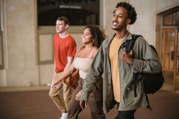 Three international students walking on the streets of Paris.